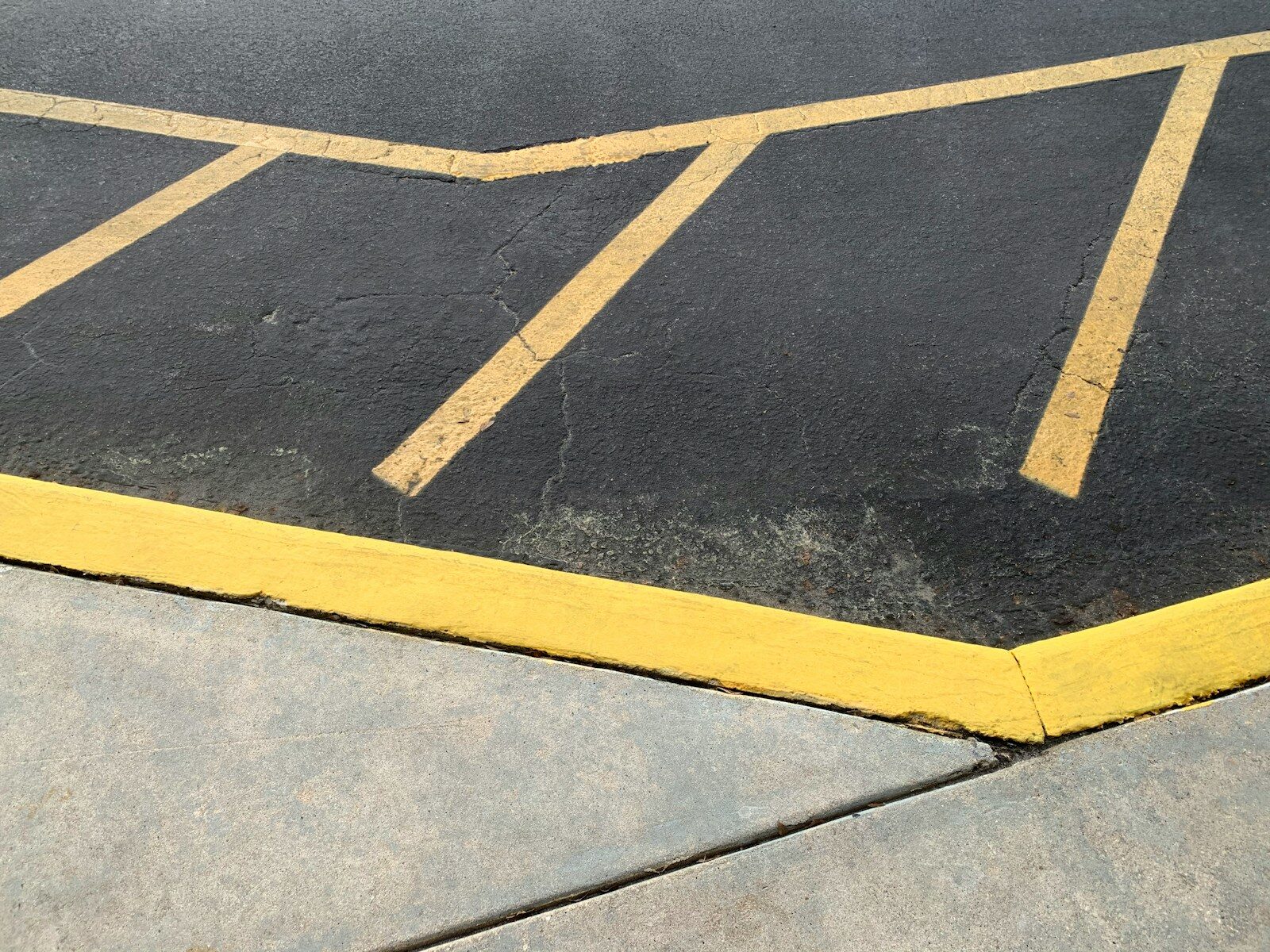 Commercial parking lot with fresh asphalt and line striping