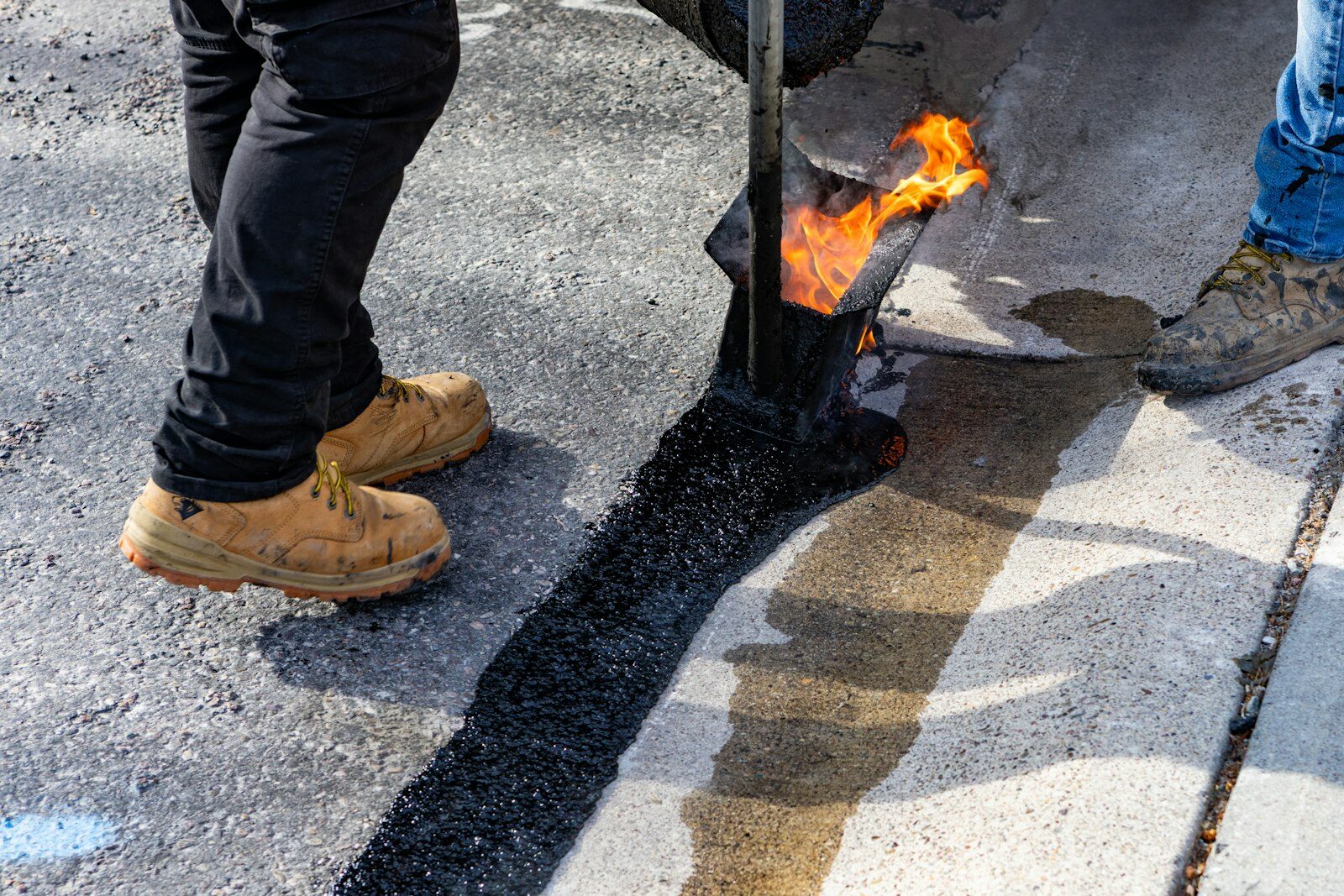 Asphalt patch repair being installed